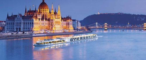 River cruise ship gliding through scenic European landscape